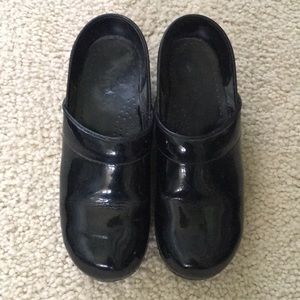 Dansko black patent leather clogs